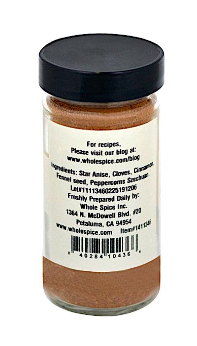A clear spice jar with a black lid holds Whole Spice Inc.’s Chinese Five Spice-North China Style. The label displays ingredients, company info, a barcode, and highlights this classic regional blend for authentic recipes.