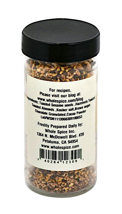 A jar of Whole Spice Inc. Chocolate Dukka, filled with delicious toasted nuts and chocolate.
