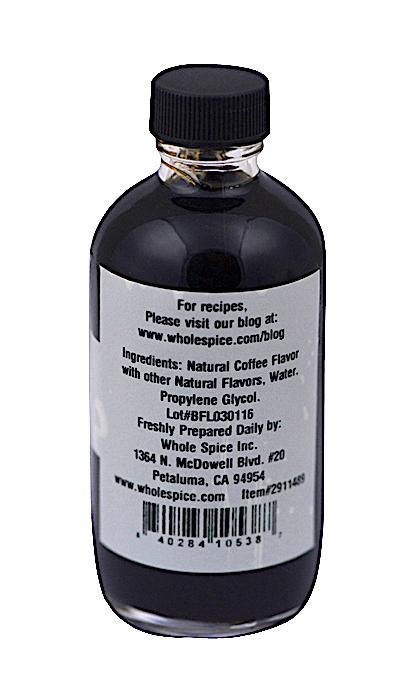 A bottle of Whole Spice Inc. Coffee Extract with black liquid and a silver cap features a label listing concentrated coffee, water, and propylene glycol from premium beans, plus company info and a website for recipes.