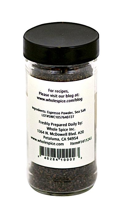 The clear Espresso Sea Salt jar from Whole Spice Inc. features a black lid, label with ingredients (espresso powder, sea salt), recipe website, and Petaluma, CA contact info—making it a unique steak rub addition.