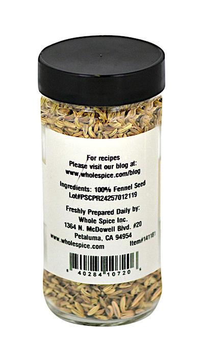 A clear spice jar with a black lid from Whole Spice Inc. holds aromatic Fennel Seeds—ingredients: 100% fennel seed. The label includes company details and address in Petaluma, CA, making it ideal for cooking enthusiasts.