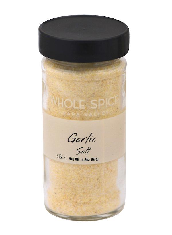 Whole Spice Inc. Garlic Salt comes in a clear glass jar with a black lid, containing a pale yellow sea salt blend. Net weight: 4.2 oz (67g).
