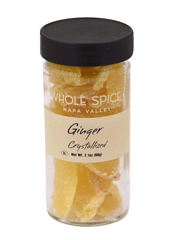 A clear glass jar with a black lid holds Ginger Crystallized by Whole Spice Inc., Net Wt. 2.1oz (60g). Enjoy the sweet warmth of real ginger in every bite.