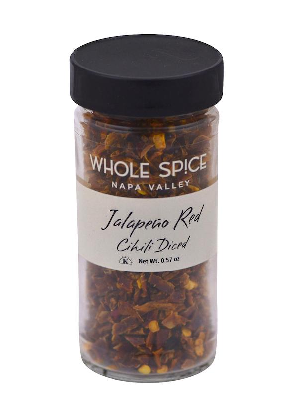 Whole Spice Inc. Jalapeño Red Chili Diced comes in a clear glass jar with black lid, containing 0.57 oz of dried chili pepper pieces—ideal for adding bold flavor to your chili stew.
