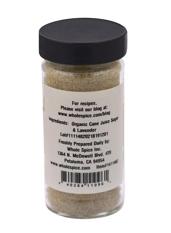 Whole Spice Inc.’s Lavender Sugar comes in a glass jar with a black lid, containing organic cane juice sugar and lavender. The label features ingredients, website, lot number, and the company’s address.