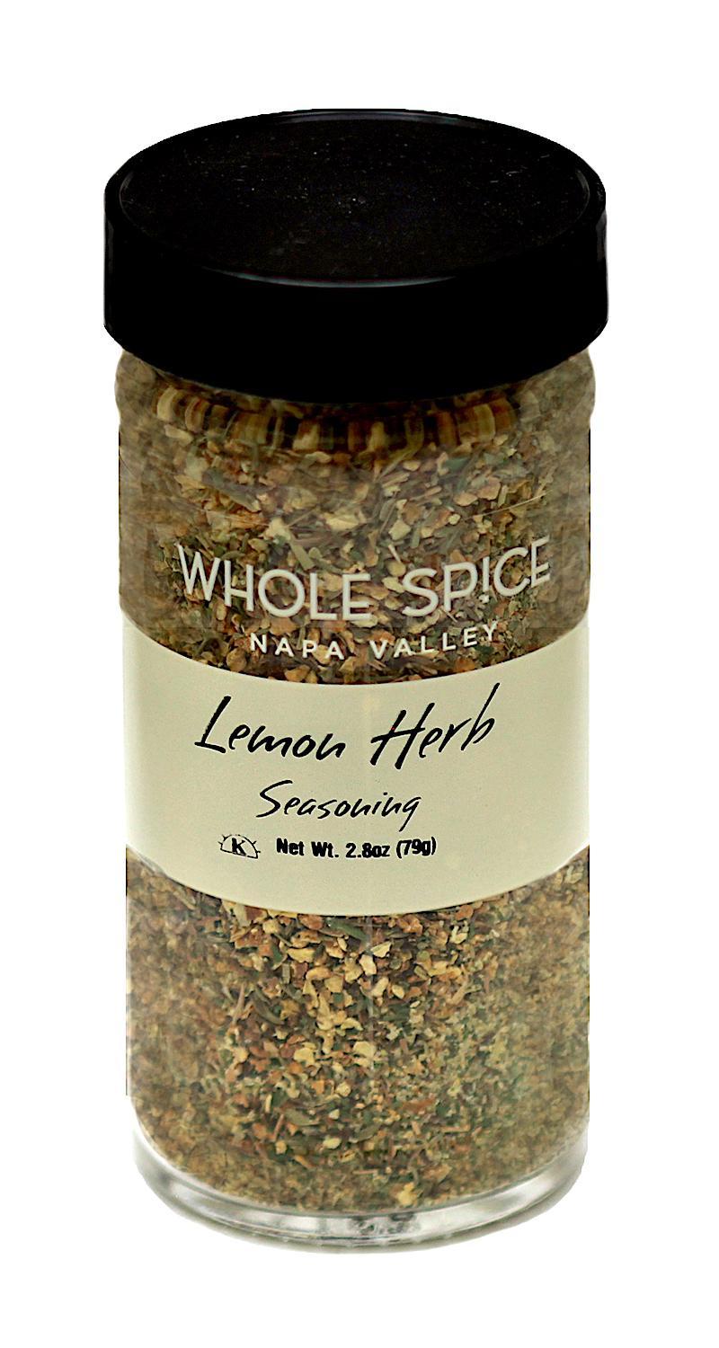 A 2.8 oz (79g) glass jar of Whole Spice Inc. Lemon Herb Seasoning—a zesty blend ideal for fish and chicken—comes with a black lid and contains premium dried herbs and spices.