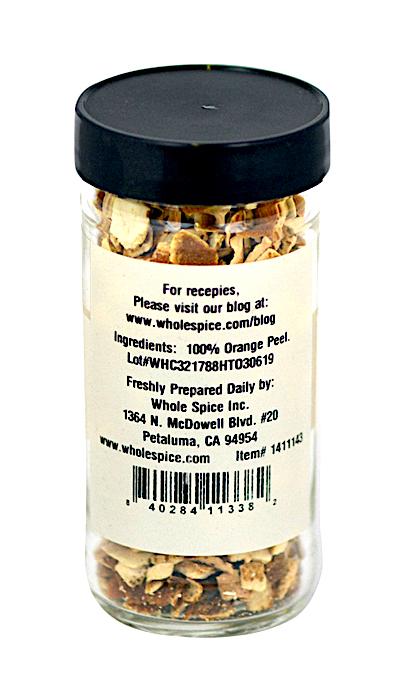 Whole Spice Inc. Orange Peels come in a clear glass jar with a black lid, containing 100% dried orange peel for bold citrus flavor. The label includes company info and a website link with recipes.