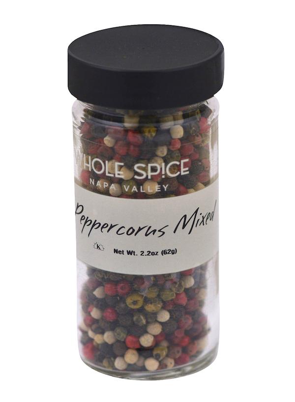 A clear glass jar with a black lid from Whole Spice Inc. holds Peppercorns Mixed (Net Wt. 2.2oz/62g). This essential spice features colorful mixed peppercorns for versatile seasoning.