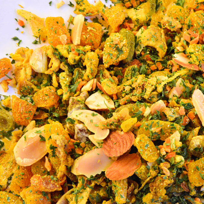 A close-up of Persian Apricot Rice Seasoning by Whole Spice Inc.—a vibrant mix with dried fruits, herbs, almond flakes, and spices—perfect for adding sweet and spicy flavor to rice dishes.