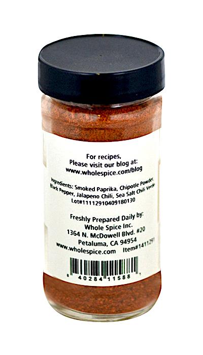 Pica Pica Black Beans Seasoning by Whole Spice Inc. comes in a clear jar with a black lid and white label featuring smoked paprika, chipotle, black pepper, jalapeno chili, and sea salt—ideal for chili or black bean salads.