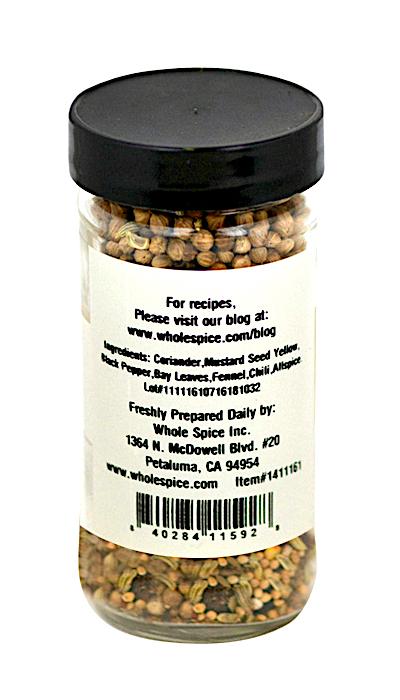 Whole Spice Inc. Pickling Spice: a clear jar with black lid containing whole coriander, mustard seed, black pepper, bay leaves, fennel, and chili—perfect for chutneys and pickled vegetables. Label includes website and contact info.