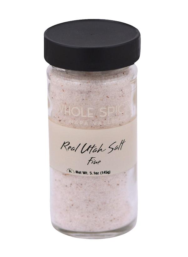 Real Utah Salt Fine by Whole Spice Inc. is a 5.1 oz (145g) jar of fine ancient pink sea salt in clear glass with a black lid, rich in trace minerals.