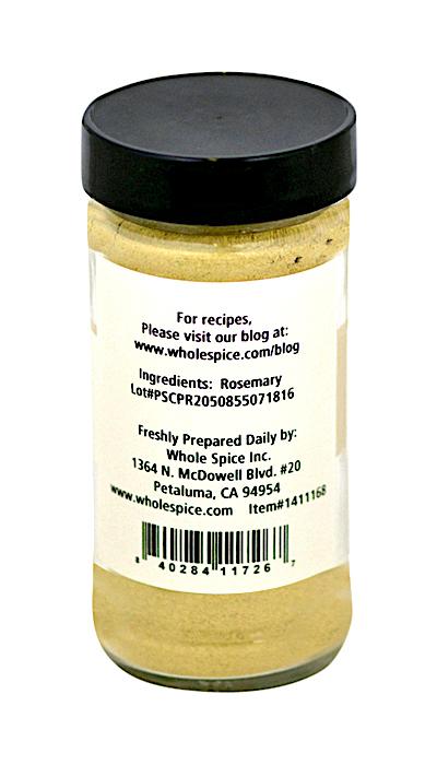 A clear jar with a black lid contains Rosemary Powder by Whole Spice Inc. The white label includes their website for recipes and contact info. Inside is a light green powder, highlighting this classic Mediterranean herb.
