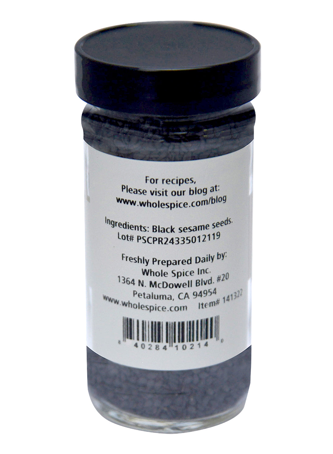 A clear spice jar labeled "Sesame Seeds Black" by Whole Spice Inc. lists black sesame seeds as the ingredient, with usage info for Chinese and Japanese cooking, a barcode, and company details from Petaluma, CA.