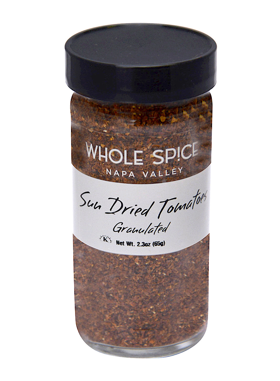 A clear glass jar with a black lid from Whole Spice Inc. holds 2.3 oz (65g) of Sun Dried Tomatoes Granulated, ideal for enhancing pasta or salads with rich tomato flavor.