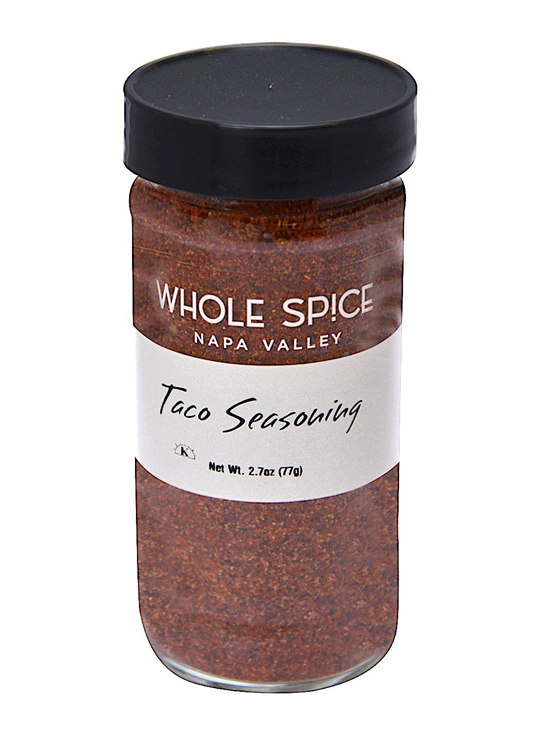 A clear spice jar with a black lid labeled Whole Spice Inc. Taco Seasoning, featuring 2.78 oz (77g) of reddish-brown Mexican spice blend, perfect for adding bold flavor to your dishes.