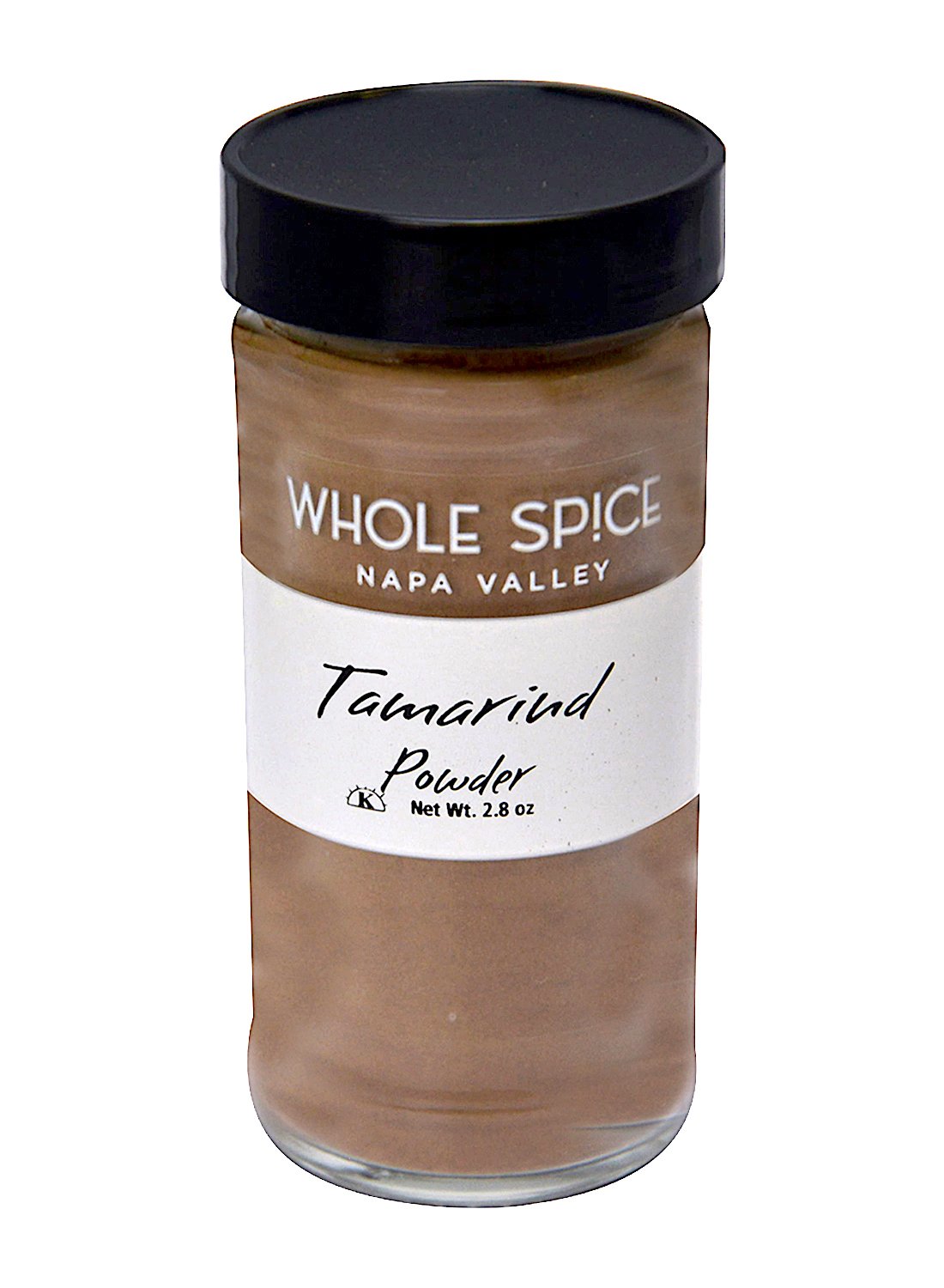A clear glass jar with a black lid labeled Whole Spice Inc. Tamarind Instant contains 2.8 oz of light brown, tangy tamarind powder often used as an ingredient in Southeast Asian cuisine.