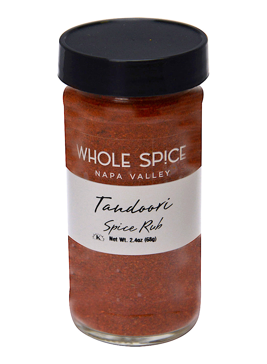 A glass jar with a black lid labeled Whole Spice Inc. Tandoori Spice Rub, Net Wt. 2.4 oz (68g), filled with a reddish-orange Indian seasoning blend.